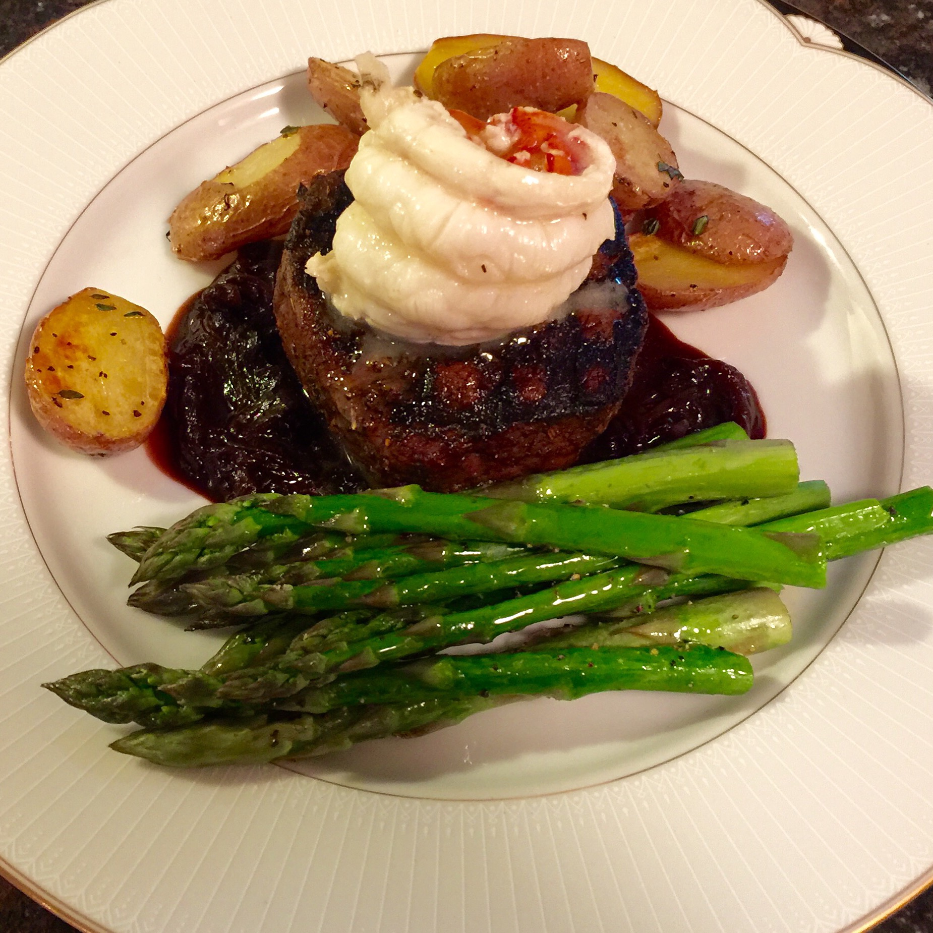 Grilled Tenderloin with Lobster Tail, Roasted New Potatoes and Asparagus